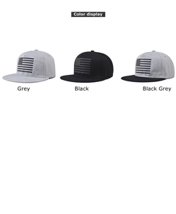 Detailed color display of flat brim snapback hats with American flag embroidery