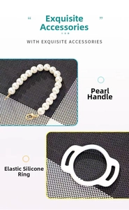 Detail of elegant pearl handle strap with gold metal clasp and flexible silicone ring