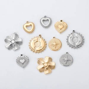 Polished stainless steel pendants set in gold and silver including flower and heart shapes