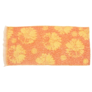 Close-up of orange floral knit scarf showing soft wool texture and jacquard flower pattern
