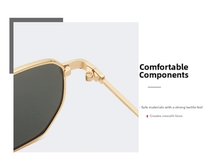 Detail shot of golden metal temples and hinge structure of oversized retro sunglasses