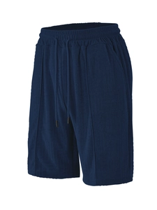 Detail of dark blue men's sports shorts with checkered jacquard texture and drawstring waist