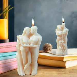 Artistic couple embrace scented candles in creamy white wax for Valentine gift decor