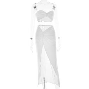 Detail showing white two-piece set with twist-knot crop top and high-slit maxi skirt