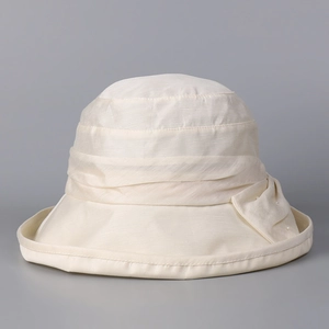Close-up of elegant Lyocell linen sun hat featuring pleated band and pearl detail