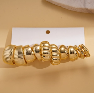 Ten-piece gold-finished geometric C-shaped stud earring set with varied metal textures