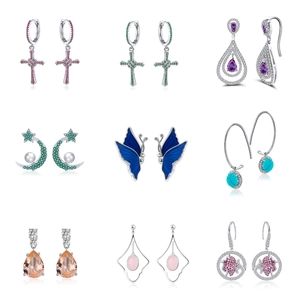 Collection of 925 silver earrings with cross, butterfly, and gemstone designs