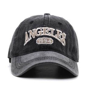 Detailed embroidery of ANGELES 1994 on washed dark gray retro cotton baseball cap