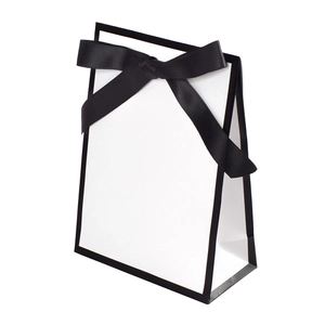 Minimalist white gift bag with black ribbon bow and border for elegant packaging