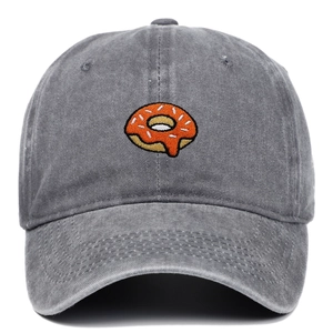 Close-up of donut embroidery on washed cotton baseball cap with vintage finish