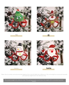 Detailed view of four glittery Christmas glasses with Santa, Reindeer, and Snowman designs