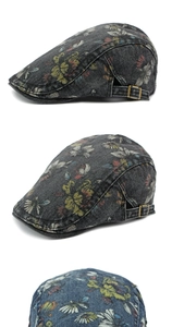 Detail view of floral denim ivy caps with vintage washed texture and bronze metal buckles