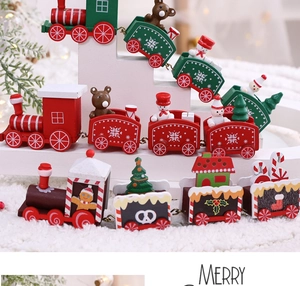 Detailed view of festive wooden Christmas train decorations with snowmen and bear figures