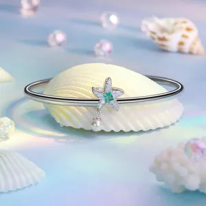 S925 sterling silver starfish bangle with emerald gemstone and white pearl detail