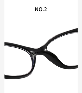Macro view of the sleek black acetate bridge and integrated nose pads of these glasses