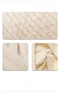 Detailed macro view of the thick chunky knit texture and soft beige wool material