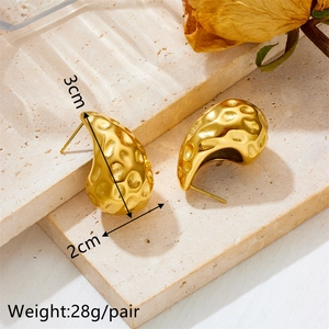 Golden teardrop earrings with hammered texture, 3cm by 2cm, made of stainless steel