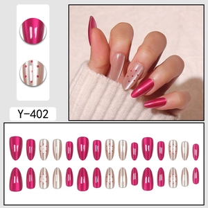 Almond shaped magenta and champagne cat eye press-on nails set with red polka dot accents