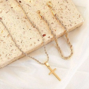 Elegant gold cross pendant necklace and matching twist chain bracelet jewelry set