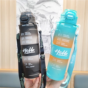Detail view of large gradient sports water bottles with time markers and carry straps