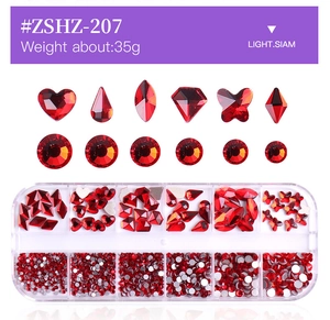 Detail of red nail art rhinestones in diverse shapes inside a 12-grid organizer box