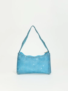 Macro detail of sparkly light blue rhinestone handbag with crystal-encrusted handle
