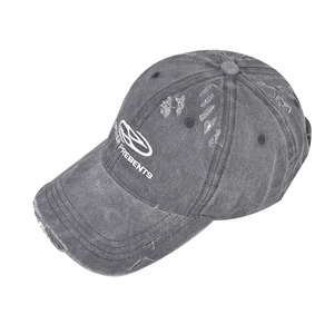Detailed view of grey washed cotton baseball cap with vintage distressed embroidery