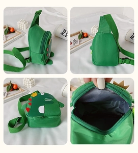Detailed views of the green dinosaur nylon chest bag showing zipper and interior space