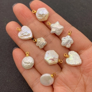 Baroque natural freshwater pearl pendants in heart and star shapes with gold clasps