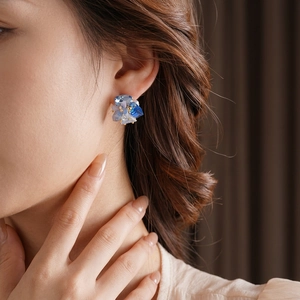 Gold-plated silver needle butterfly crystal stud earrings on model for elegant styling