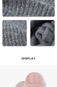 Close-up of thick ribbed knit texture on pink and grey wool blend winter beanies