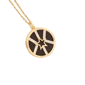 Gold star pendant necklace with black circular inlay and micro-pave cubic zirconia crystals