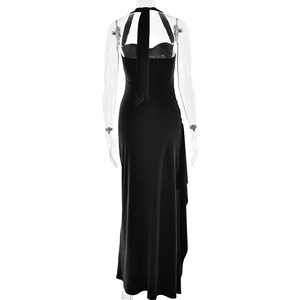 Detail view of backless halter evening dress showing sleek black fabric and high slit cut