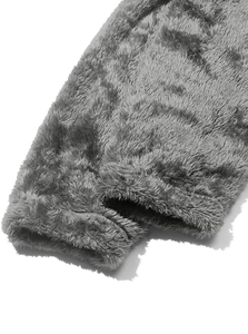 Detail of high-density grey polar fleece fabric with double-stitched hem and soft texture