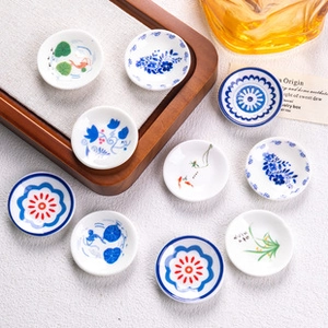 Set of 10 miniature ceramic plates featuring assorted blue and white floral patterns
