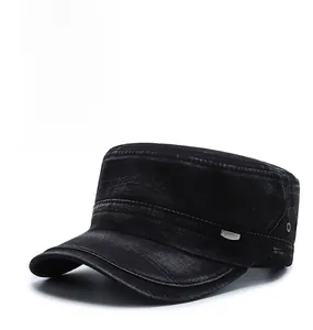 Detail view of washed black cotton denim flat top army cap with metal sport badge