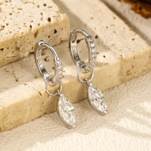 S925 sterling silver hoop earrings with teardrop moissanite on a textured stone