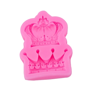 Pink crown silicone mold for chocolate fondant and cake decoration on white background