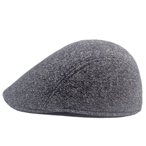 Close-up of winter men's grey herringbone beret showing thick textured fabric detail