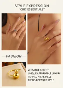 Detail of gold and silver tone double ball open ring on minimalist jewelry box