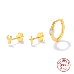 Detailed macro view of 925 sterling silver star and moon earring set with gold plating