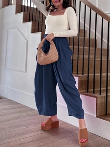 Navy blue high-waisted wide-leg cotton pants with elastic drawstring and side pockets