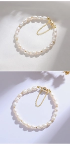 Detailed macro of 7mm freshwater pearl bracelet with gold beads and safety chain lock