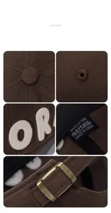 Macro view of MORA embroidery and bronze metal adjustment buckle on cotton baseball cap