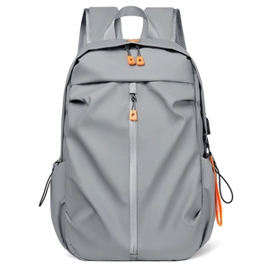 Large gray travel laptop backpack with distinctive orange zipper pulls on white background