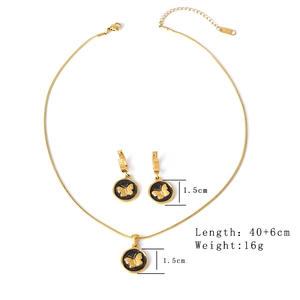 Golden stainless steel jewelry set featuring black circular pendants with 3D butterfly