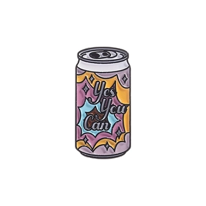 Cartoon soda can enamel pin with 'Yes You Can' text in colorful geometric style