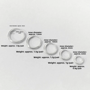 Detailed macro view showing five sizes of polished S925 silver hoop earrings with stamps