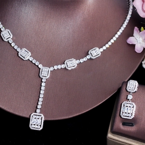 Close-up of sparkling zircon bridal necklace and earrings set on jewelry display