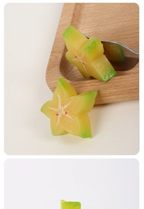 Close-up of realistic PVC star fruit slice with yellow-green gradient on a wooden plate